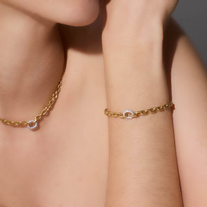 MORRELL 18K GOLD GRADUATED LINK CHAIN BRACELET WITH ONE DIAMOND LINK